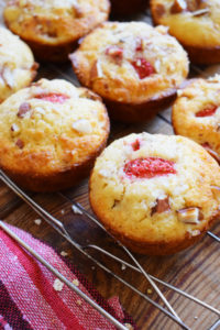 strawberry almond muffins on a cooling rack