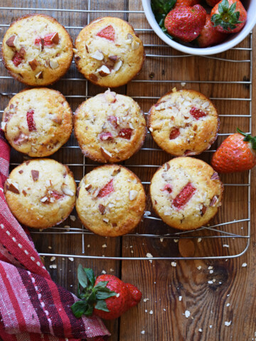 Strawberry Almond Muffins on a cooling rack.
