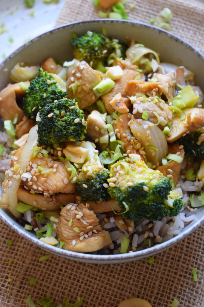 close up of the chicken broccoli and cashew stir fry in a bowl.