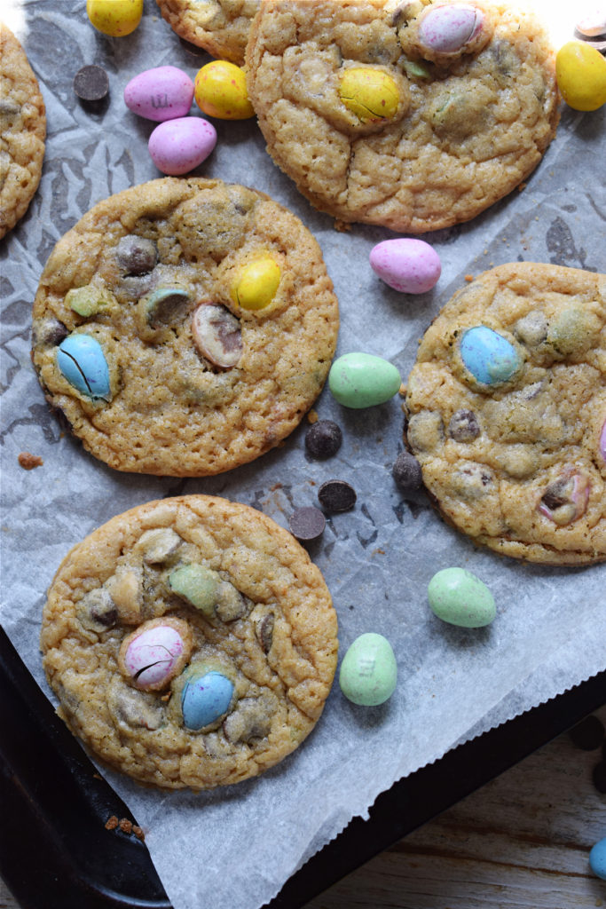 Mini egg cookies on a baking tray.