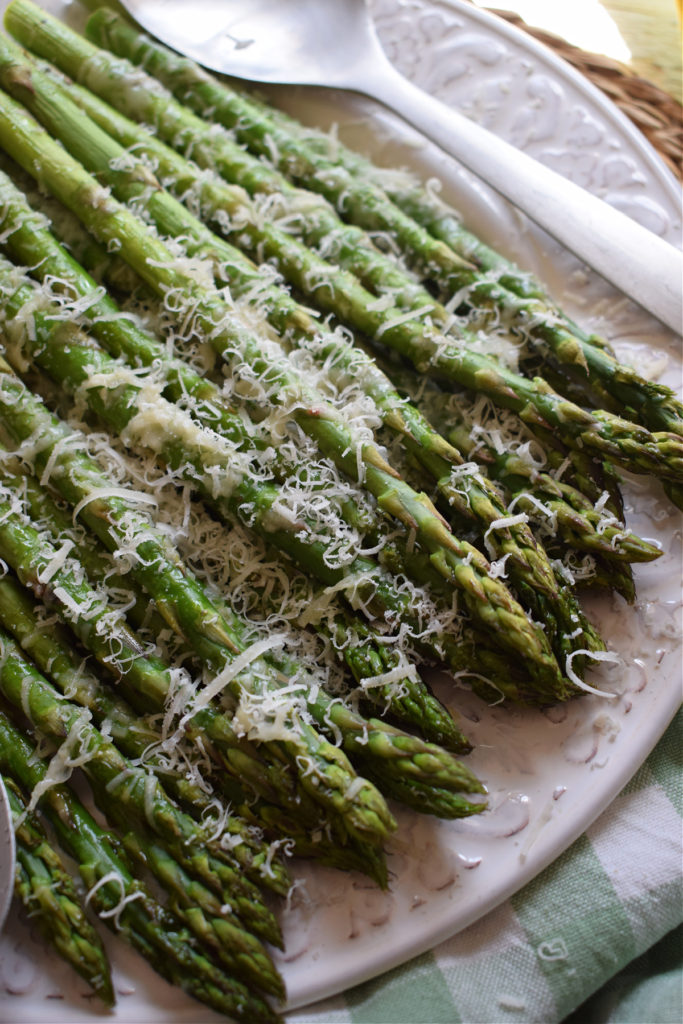 Close up of roasted asparagus with parmesan cheese.