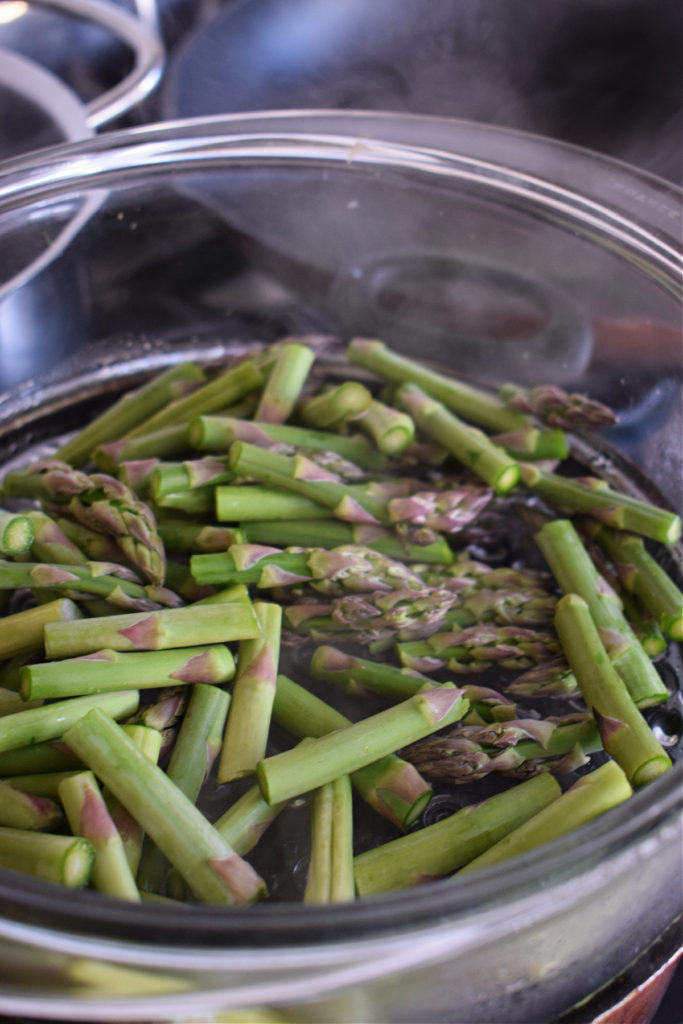 Steaming asparagus for pasta primavera.