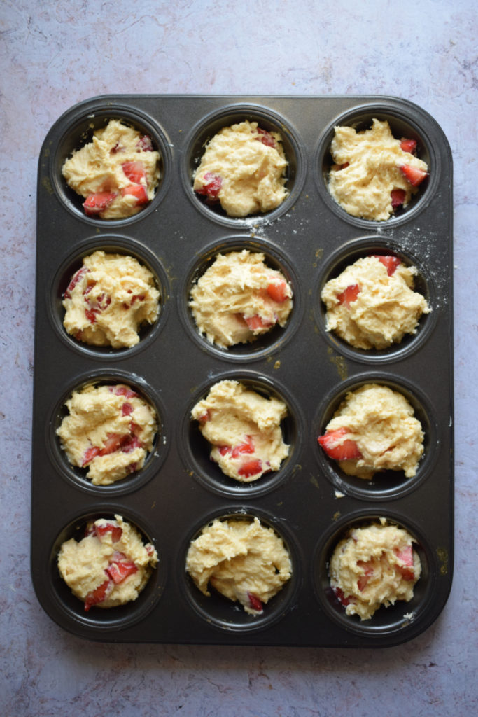 Muffins in a baking tray ready to bake.