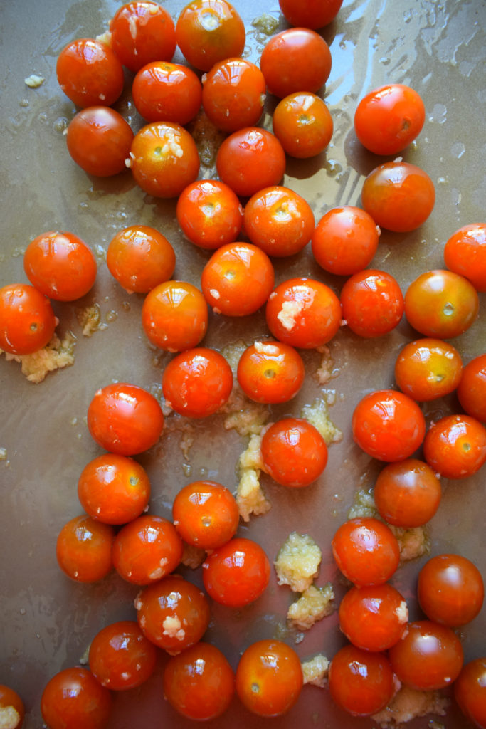 Cherry tomatoes on a bakking sheet.