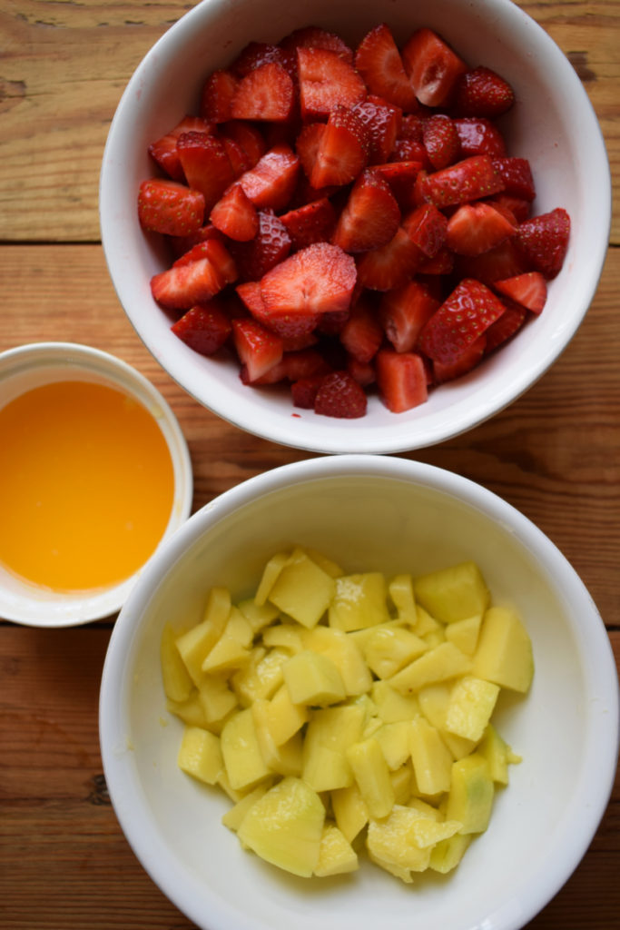 Chopped strawberries and mangoes and squeezed orange juice.