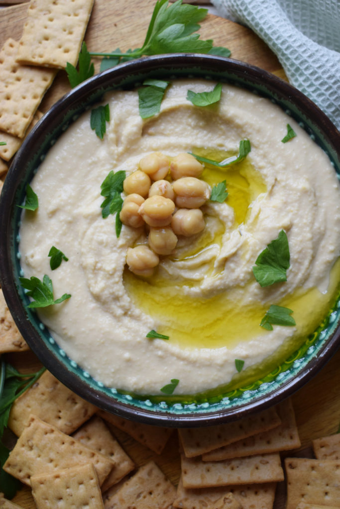 Hummus in a bowl with chickpeas.