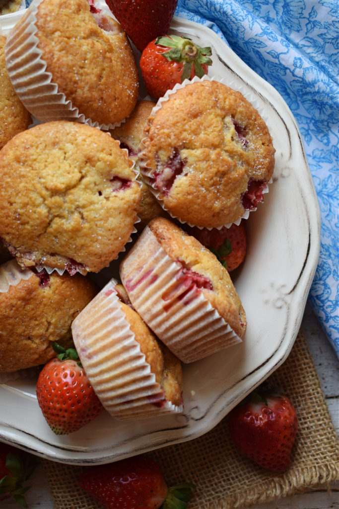 Strawberry Shortcake muffins ina bowl with strawberries.