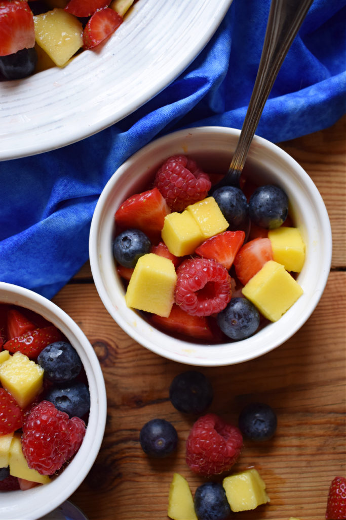 berry and mango salad in small cups.