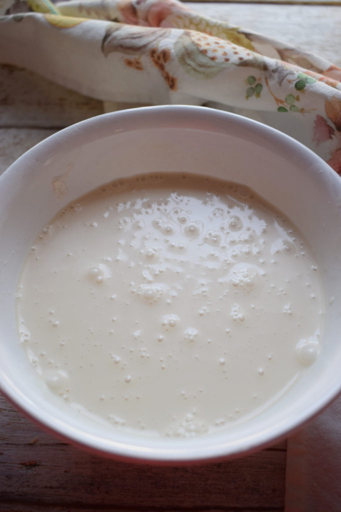 Whisked egg and milk in a bowl.