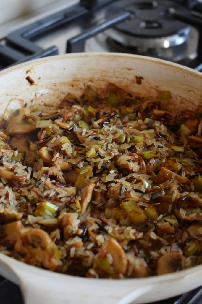 Cooking wild rice in a skillet.