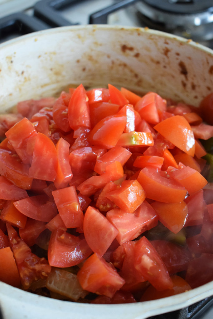 Diced tomatoes in a skillet.