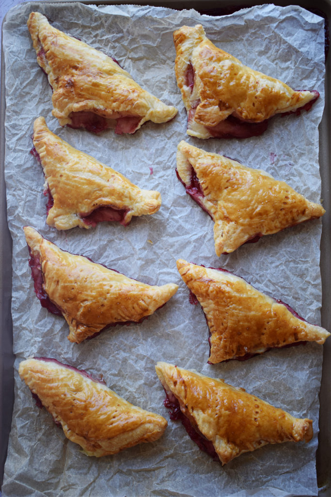 Freshly baked puff pastry jam turnovers.