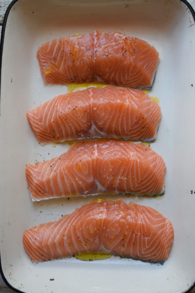 Salmon fillets in a baking dish.