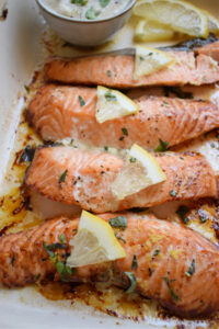 Baked salmon in a baking dish.