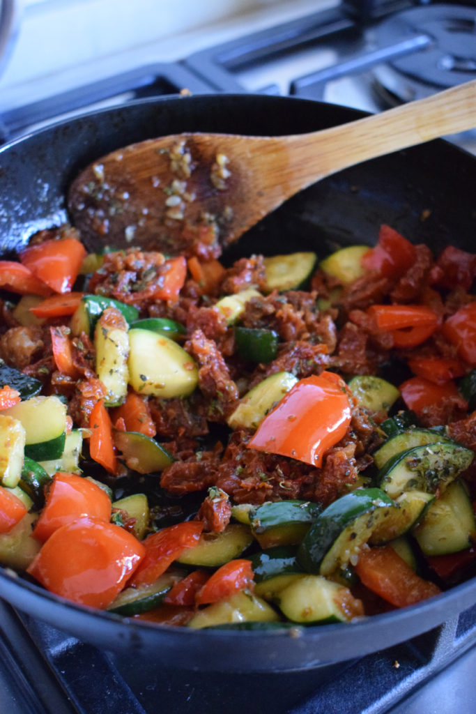 Cooked vegetables in a skillet.