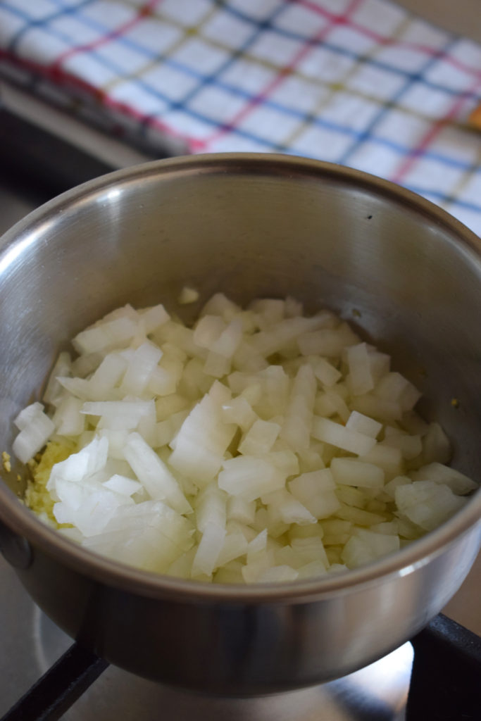 Chopped onions in a saucepan.