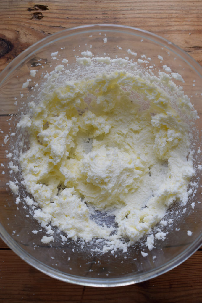 Mix butter and sugar on high speed.