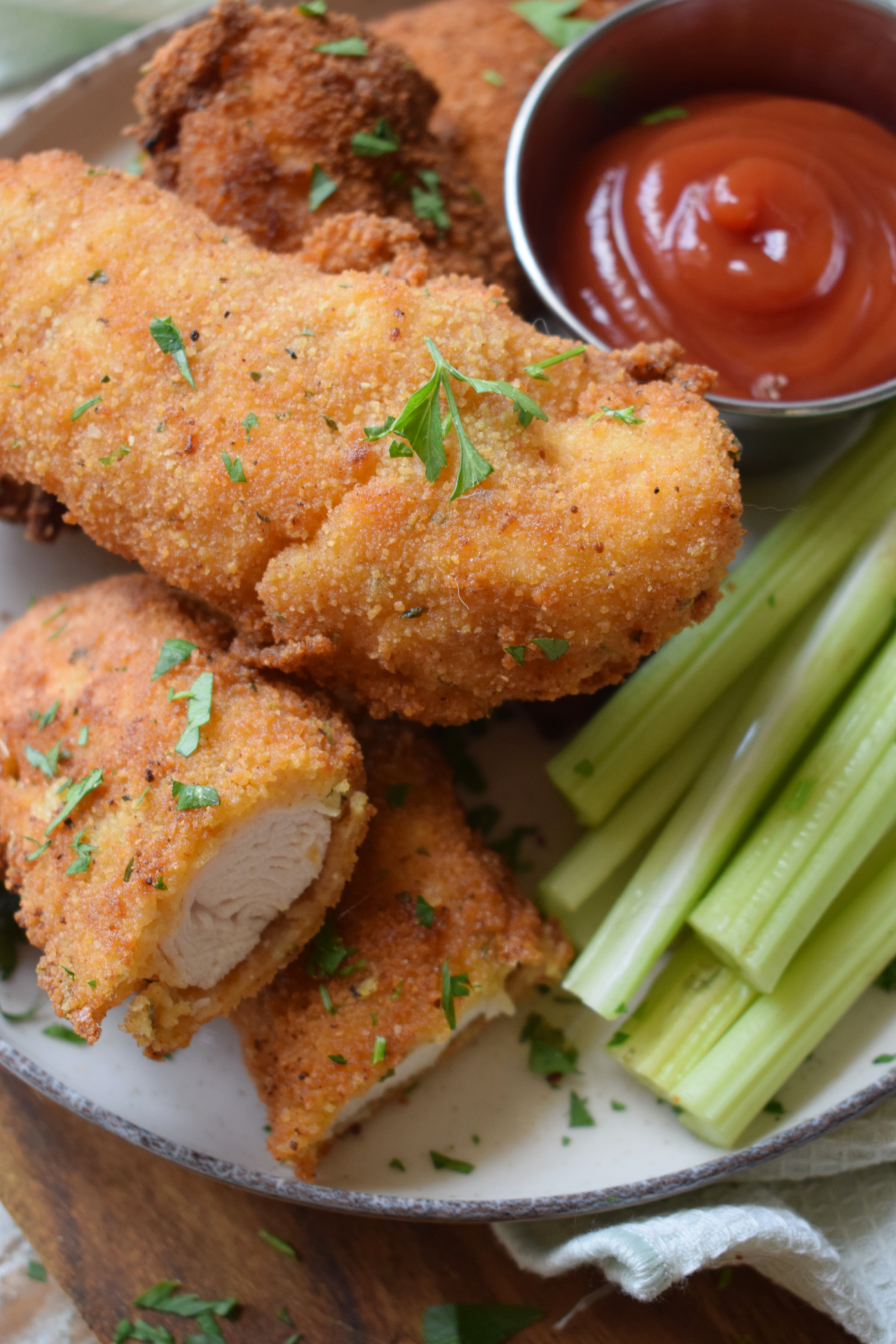 Close up of breaded chicken tenders.