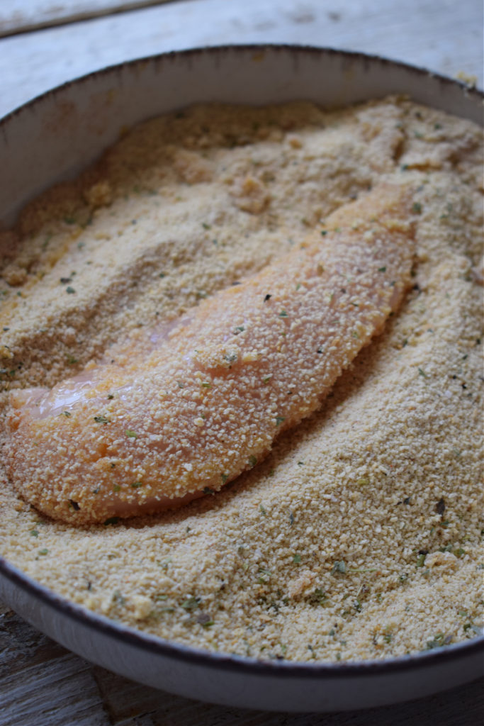 Coated chicken tenders in seasoned bread crumbs.