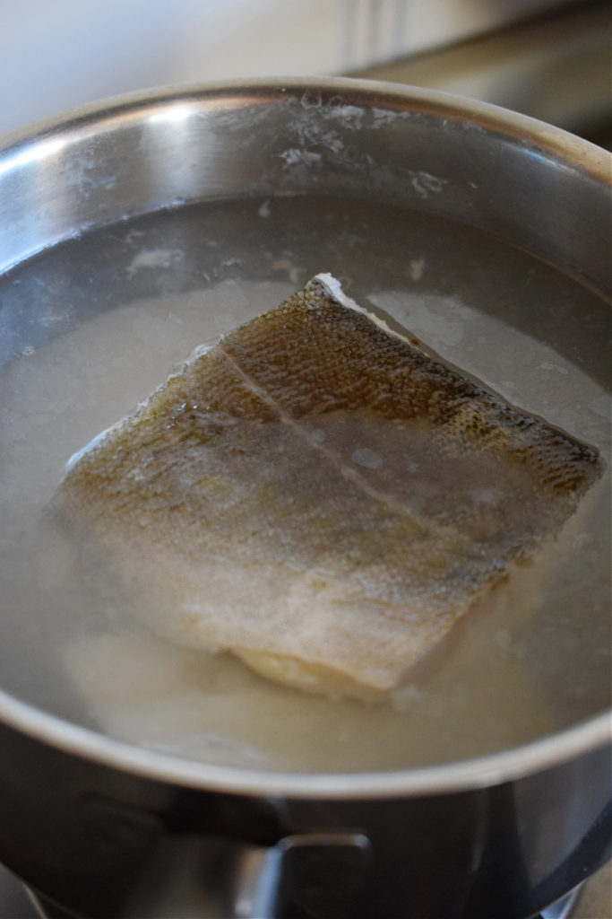 Cooking fish for fishcakes.