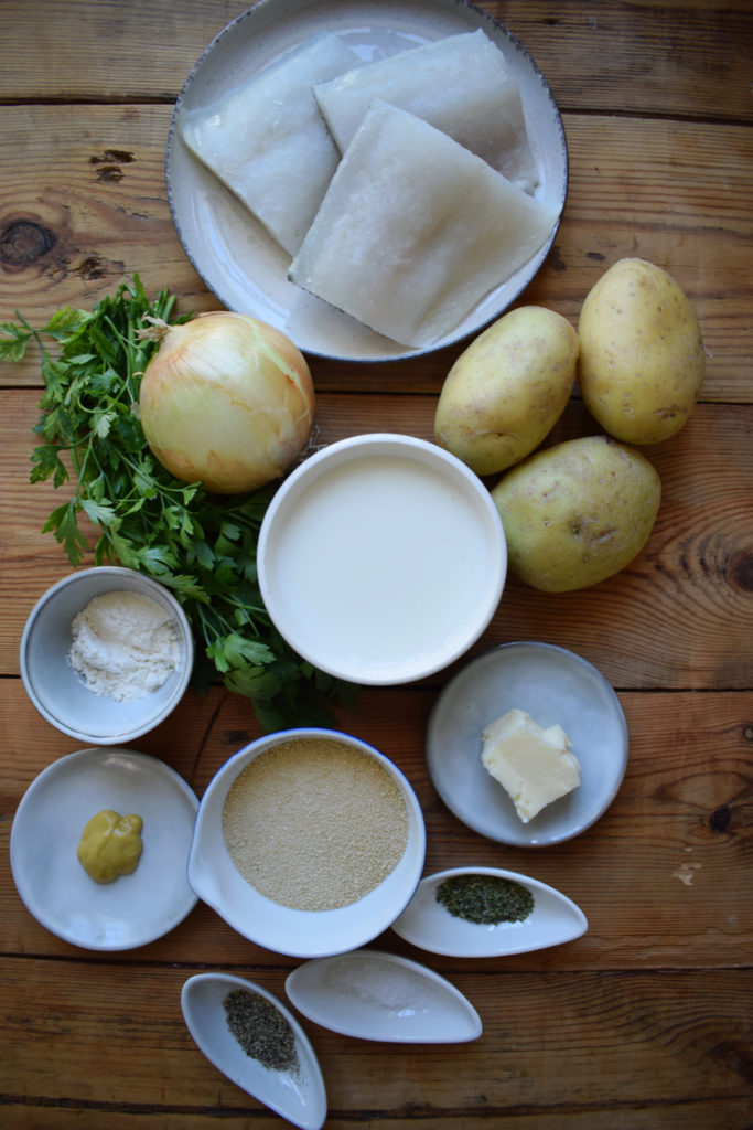 Ingredients to make crispy cod cakes with parsley sauce.