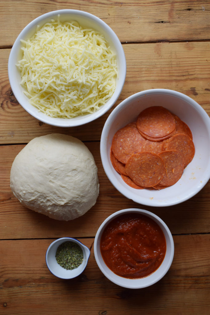 Ingredients to make sheet pan pepperoni pizza bites.