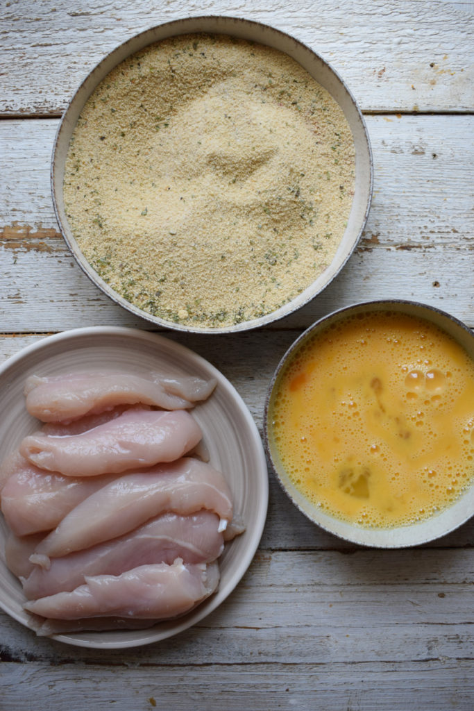 Ingredients to prepare chicken tenders.