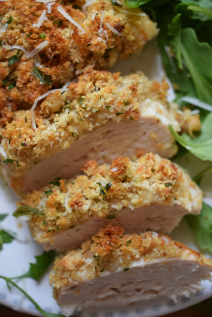 Baked Chicken sliced on a plate.