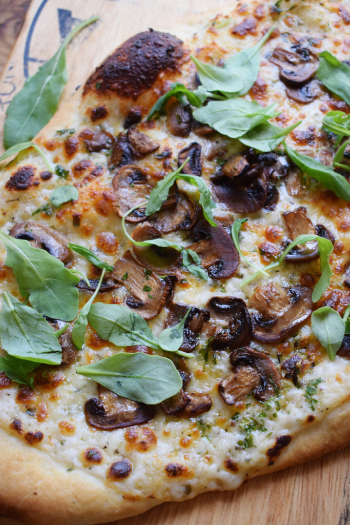 Close up of the mushroom alfredo pizza.