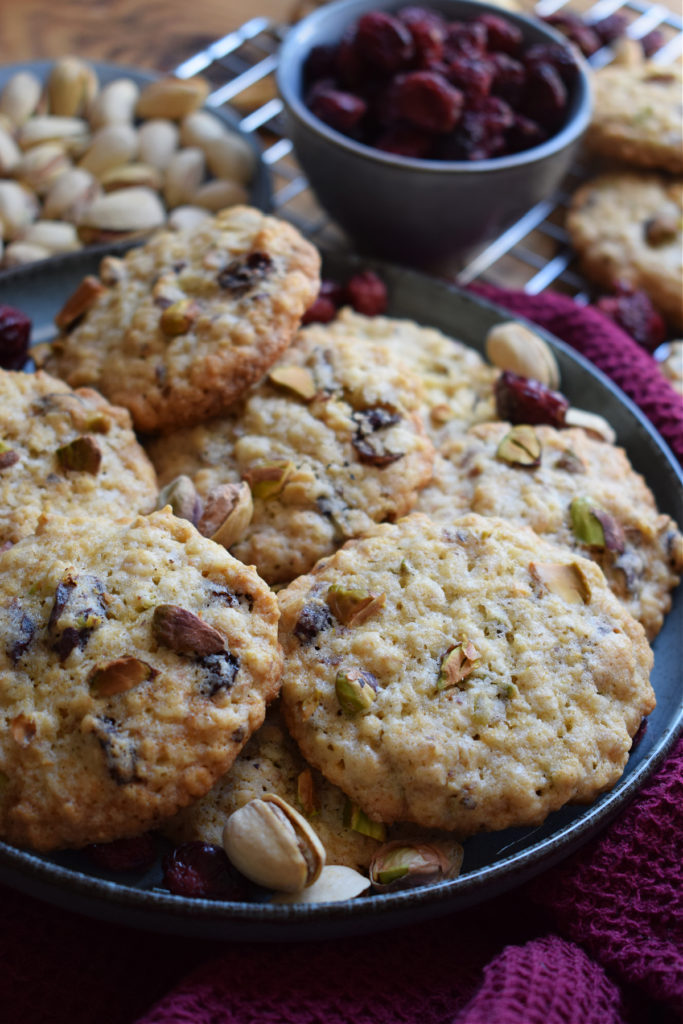 Cranberry pistacho cookies on a plate.