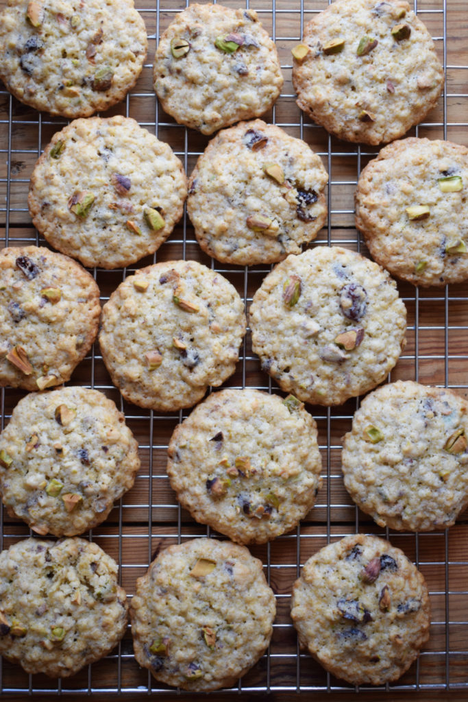 Cranberry pistachio oatmeal cookies on a cooling rack.
