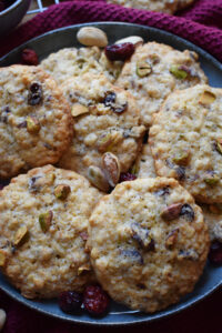 Pistachio oatmeal cookies on a blue plate.