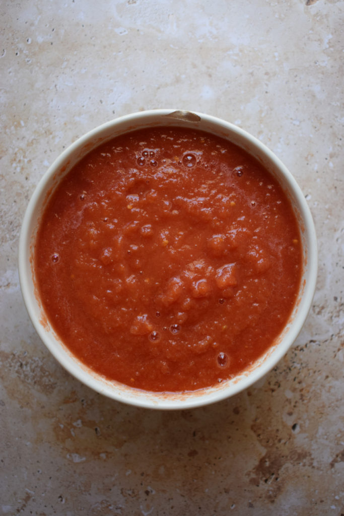 Blended tomatoes in a bowl.