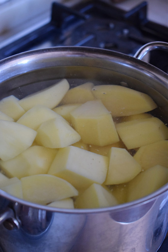 Boiling potatoes in a saucepan.