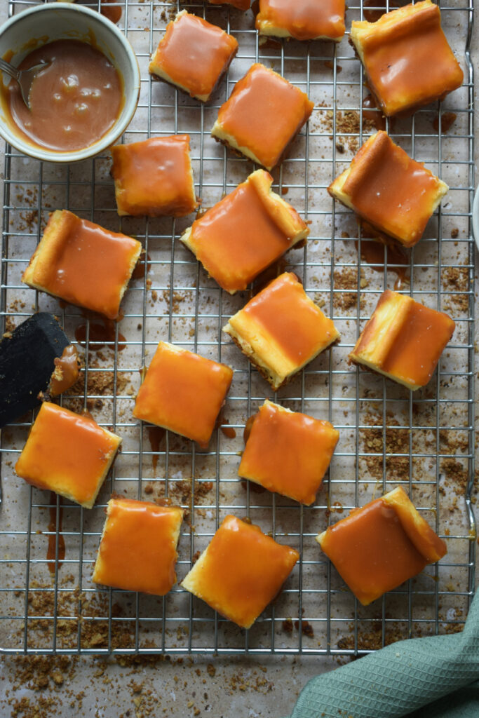 Cream Cheese Caramel Cookie bars on a cooling rack.
