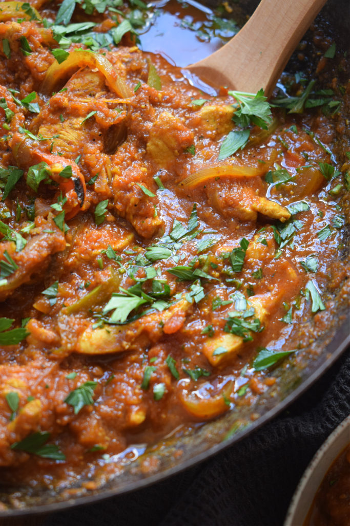 Close up of chicken jalfrezi in a skillet.