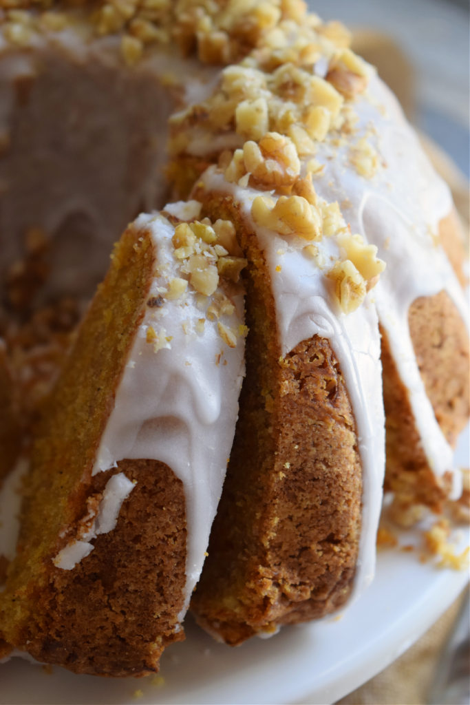 Close up of a carrot cake with nuts.