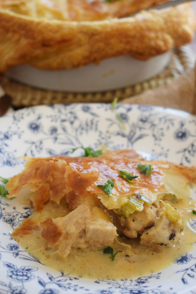 Chicken pie on a blue floral plate.