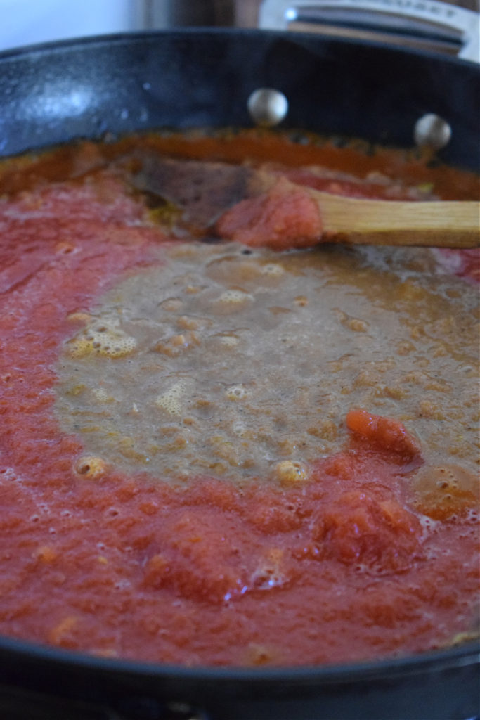 Making jalfrezi sauce in a skillet.