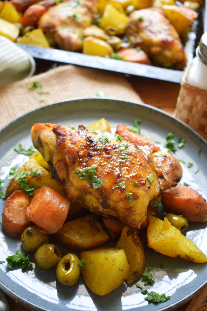 Moroccan chicken and vegetables on a plate.