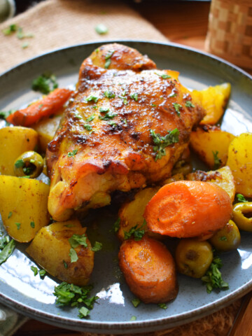 Moroccan chicken and vegetables on a plate.