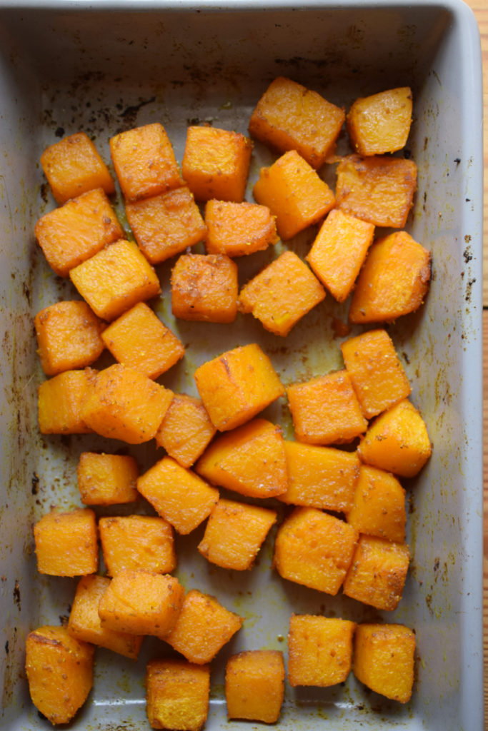 Roasted butternut squash in a baking dish.
