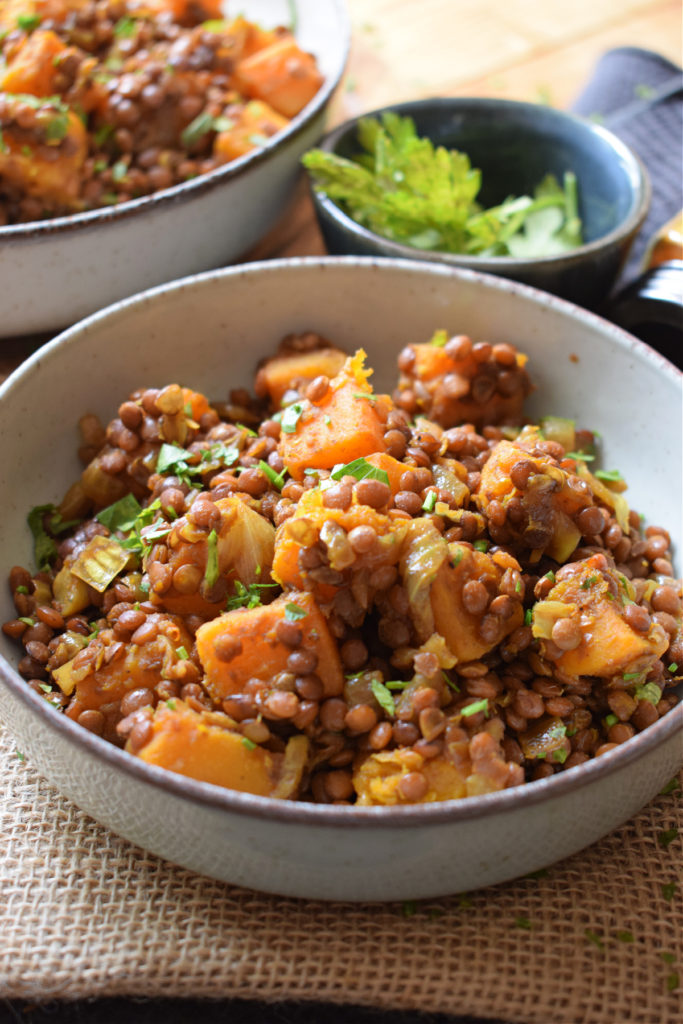 Roasted butternut squash and lentils in a bowl.