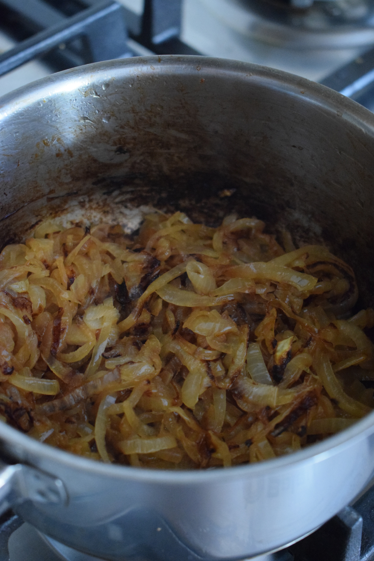 Caramelized onions in a saucepan.