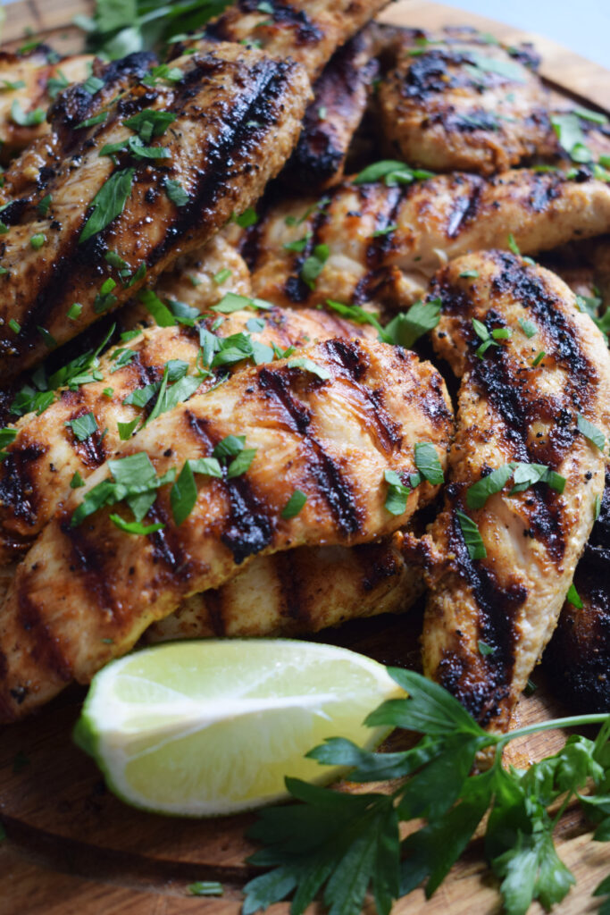 Close up of the Tex-Mex chicken tenders with limes.
