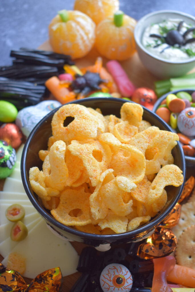 Halloween  chips in a black bowl.
