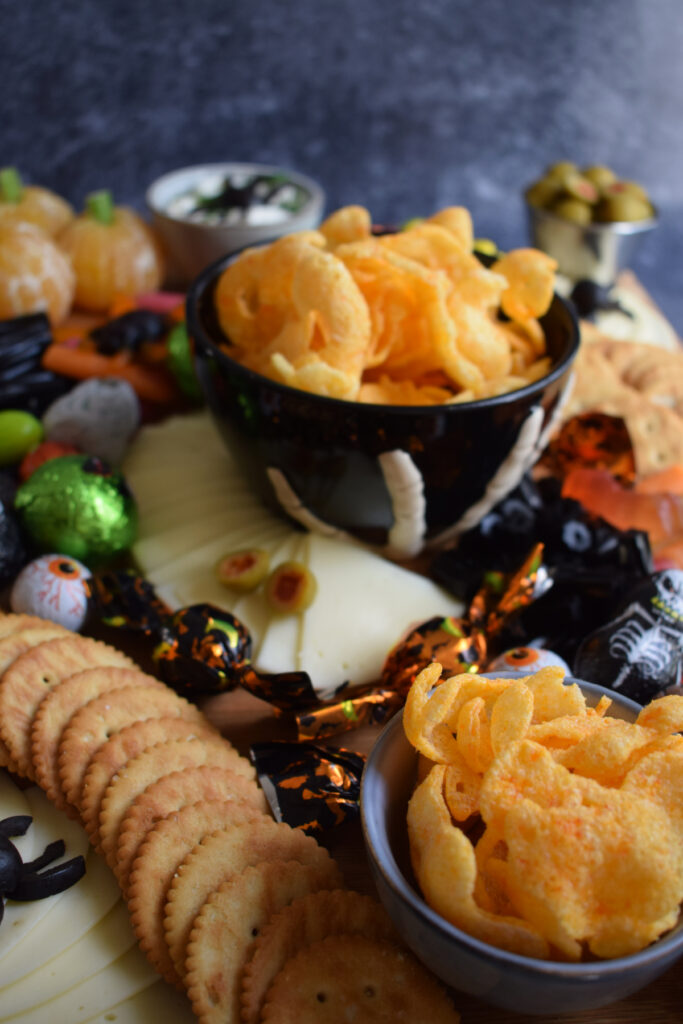 halloween snacks on a board.