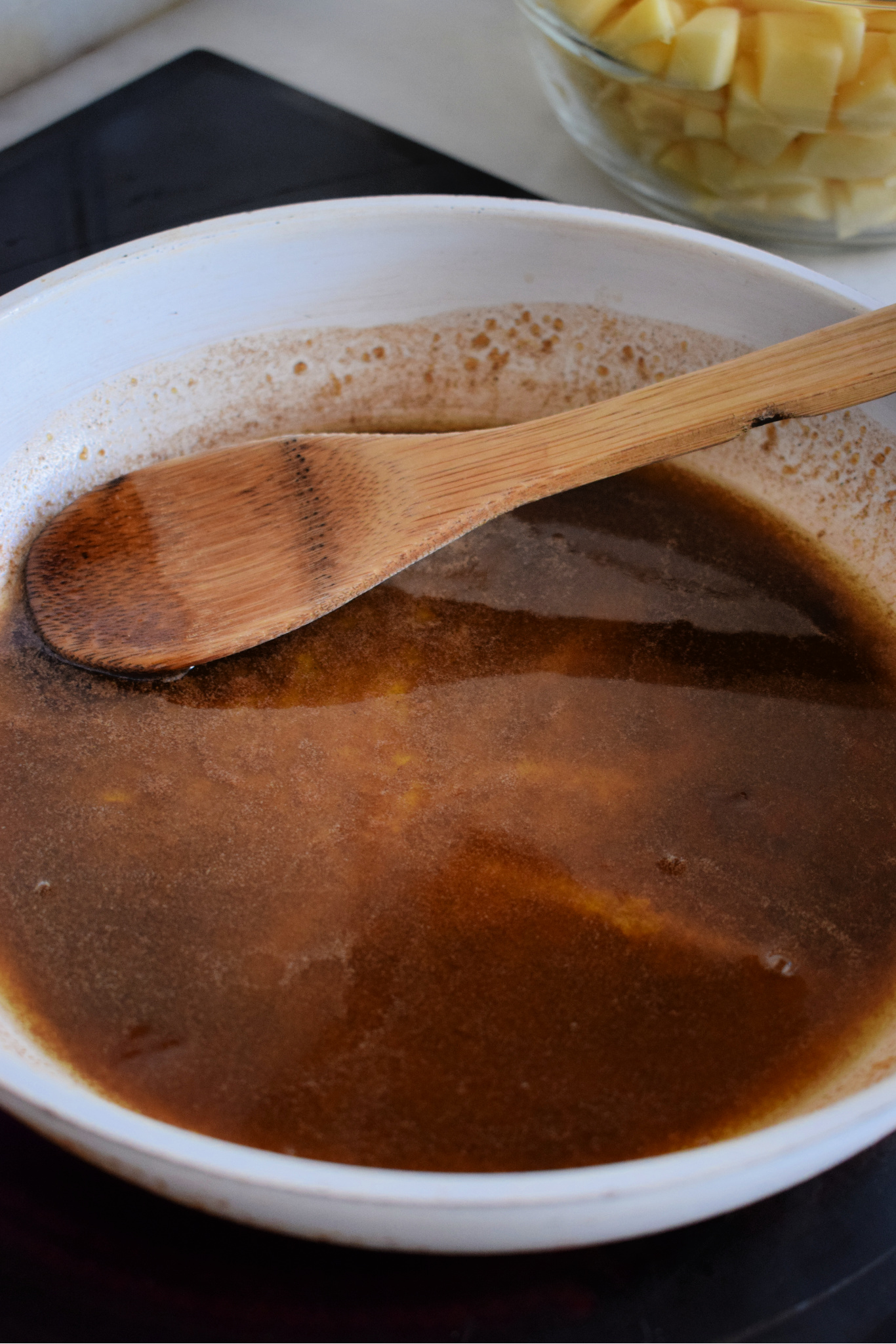 Melted butter with brown sugar in a skillet.