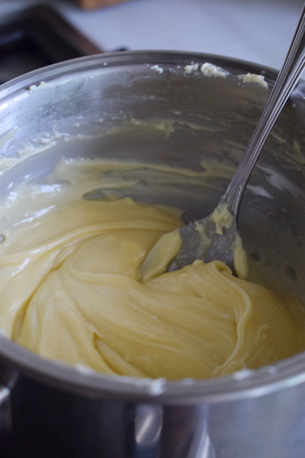 Melting white chocoalte in a double boiler.