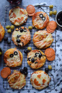 Mini pizzas on a rack.
